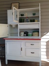 Hoosier has flour sifter, bread drawer and roll down storage