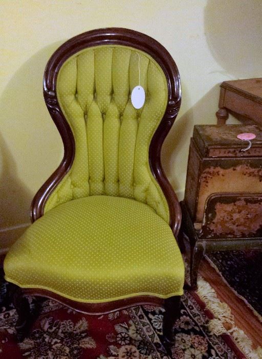Victorian tufted chair with tufted back, fabric is lime green small polka dot