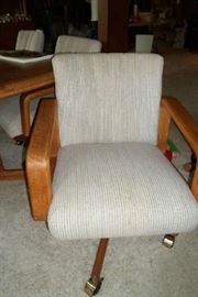 we have 6 of these great chairs on rollers, has dining table w/leaf too