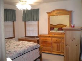 Broyhill bedroom set..King bed, night stand, dresser, mirror, chest of drawers and chest with two drawers. King mattress and box springs...has been vacuumed weekly.