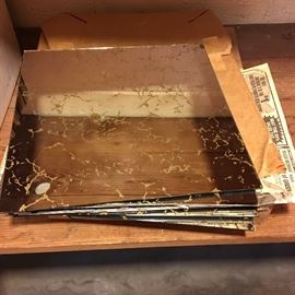 A large stack of vintage 12x12 mirror tiles.