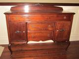 Elegant and graceful Queen Anne sideboard. Approximately 56" wide, 22" deep.