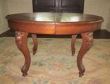 Antique oval Victorian oak table; 48" long, 36" wide.