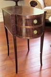 Small Sheraton 2-drawer side table with bowed front. Flame mahogany.