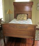 Beautiful full-size antique quartersawn oak bed with applied carvings. Headboard height is approximately 80".