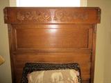 Close-up of antique bed.