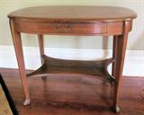 Antique oak oval library table with drawer.