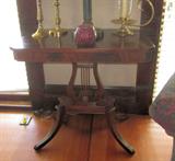 Vintage mahogany side table with lyre base.