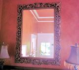 Large, decorative mirror.