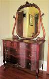Beautiful mahogany serpentine front dresser; beveled mirror; circa 1910.