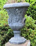 Large outdoor urn with Greco-Roman figures.