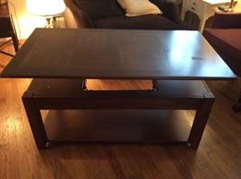 Coffee Table Adjusts & can Raise & lower