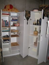 2 white 2-door cabinets, books etc