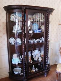 ANTIQUE CURIO CABINET FILLED WITH ANTIQUE CHINA AND GLASS PIECES