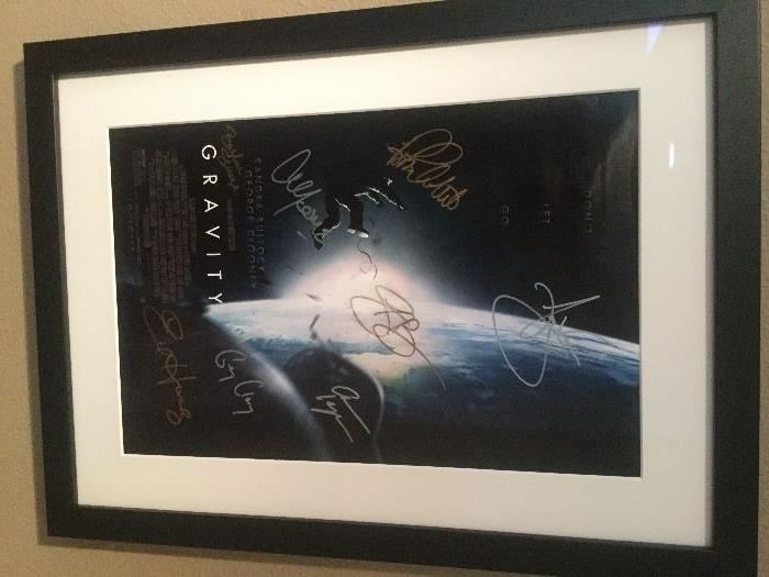 Signed Gravity poster - signed by George Clooney, Sandra Bullock, Ed Harris, Orto Ignatiussen, Amy Warren, Basher Savage, and Alfonso Cuaron
