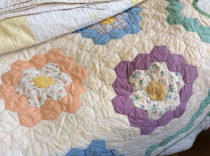 Wonderful quilts. Grandmothers Garden and more.