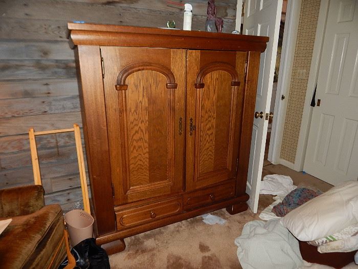 Lg oak cabinet.  Originally was a TV cabinet.  Has been outfited with shelves.  The owner used if for a computer desk.