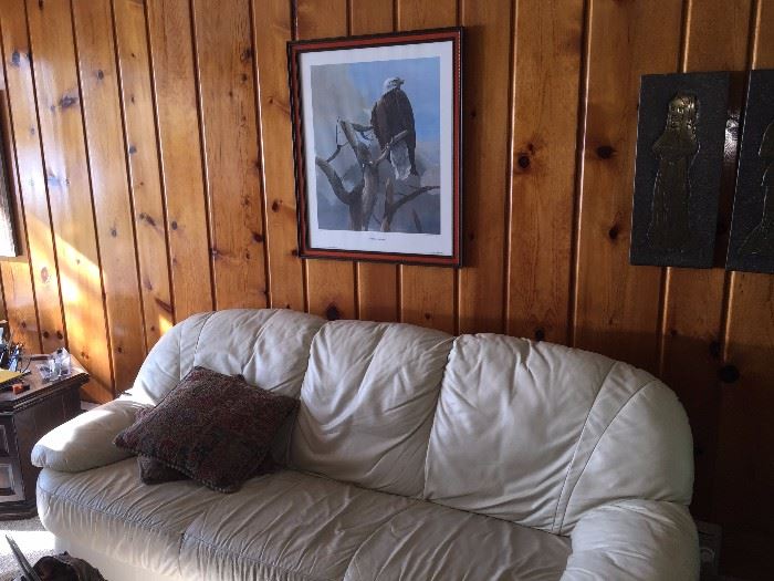 White leather sofa and signed and numbered print of eagle