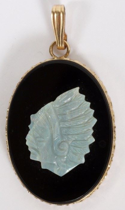 Lot#32, CARVED OPAL AND ONYX PENDANT, H 1 1/8"A carved opal depicting a Native American man mounted on onyx in a 14KT yellow gold pendent.