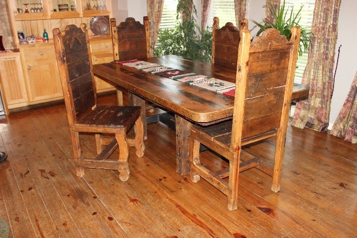 Dining table.  Handmade 17th century barn wood, detailed with hand hammered copper and iron trim.  With 8 chairs, (4 not pictured)