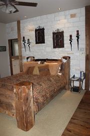 rustic king size bed, wall art, side table