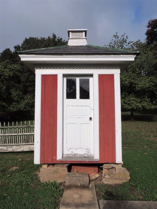 early double seat outhouse with window and vent
