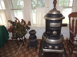 Cast iron stoves. large is by Geneva Andes, smaller one is Yale