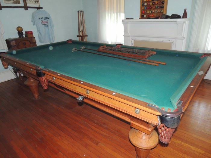 antique Brunswick pool table with wood and ivory inlay in beautiful condition
