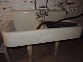 double porcelain sink with soap holder and faucet