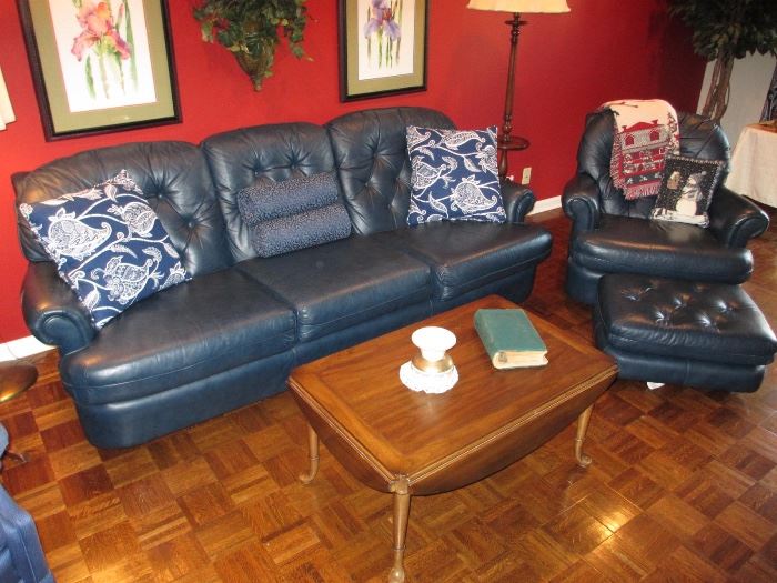 Navy blue leather sofa, chair and ottoman