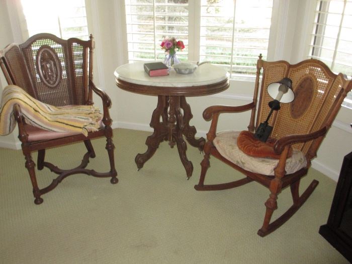 Vintage caned rocking chairs, marble top tables