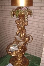 plaster cherub fountain------re-circulates water with a light at the top
