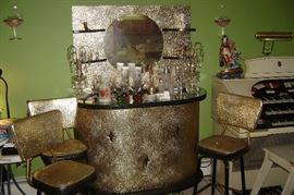 1960's gold round bar with matching gold (3) bar stools and matching mirror---some rips in 2 of the chairs--they are like gold tin foil material---mirror hangs on wall