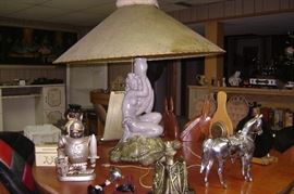 lady on top of a turtle lamp---1950'd has a pea green shade