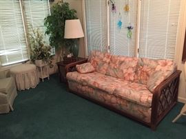 Rattan Sunroom Sofa -  also is Sofa Bed.    Vanity cushion seat, wicker floral.  Artificial Ficus Tree.