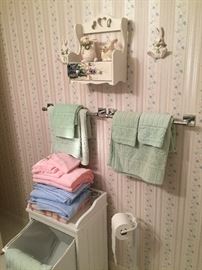 White hamper/cabinet, Linens, Towels