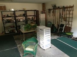 Vintage Childs wicker rocker,  Plastic rolling cabinets, trellis,  yard tools, small Kenmore refrigerator,  Miscellaneous tools, ladders, etc.