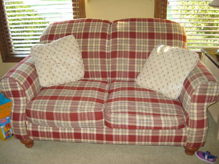 red plaid love seat, one of two.