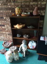 Collection of stones and shells.  Bookcase.