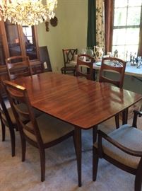 1960s dining room table with six chairs, matching China but priced separately.