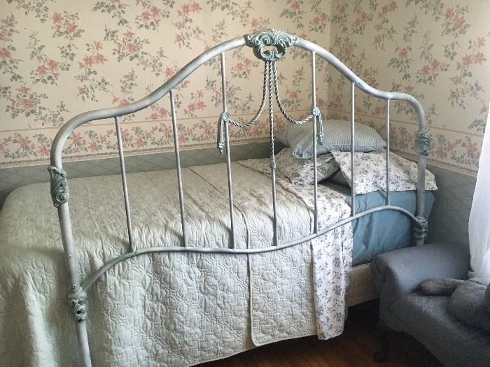 Twin size bed; ornate metal full size headboard.