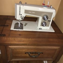 Vintage Sears sewing machine with cabinet.
