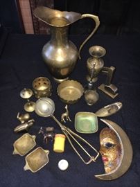 Assorted vintage brass and other metal items.