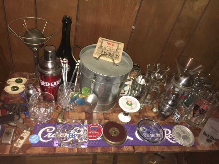 Assorted vintage and contemporary bar items.