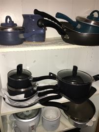 Lots of kitchenware--pots and pans, glassware, small appliances and more.