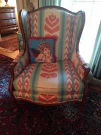 God awful Mee-maw 1980's time capsule flame-stitched armchair.                                                                    Yes, it CAN be (must be?) reupholstered, with the quickness! Horrible angle pillow free with purchase.