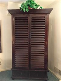 Tommy Bahama-esque louvered linen press, entertainment center thing. It's an open and shut case, just review the next picture. This thing is super heavy and will outlast a Tsunami!