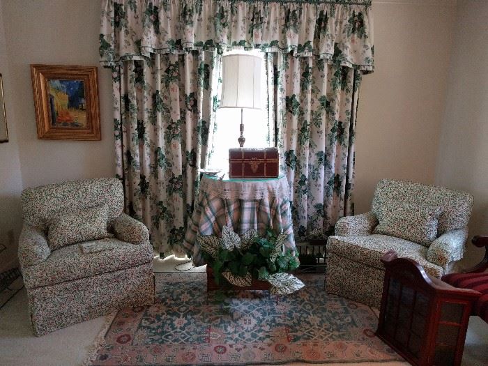 Nice pair of upholstered armchairs, by the Charles Stewart Co., Hickory, NC, covered in Brunschwig & Fils pink/green Ciruelas print; the God-awful high mortuary-style window treatments are also for sale.                      Please come buy them!