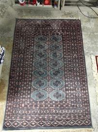 This is a hand-woven, 100% wool Bokara rug, with unusual coloring; measures 4' 3" x 6' 5".