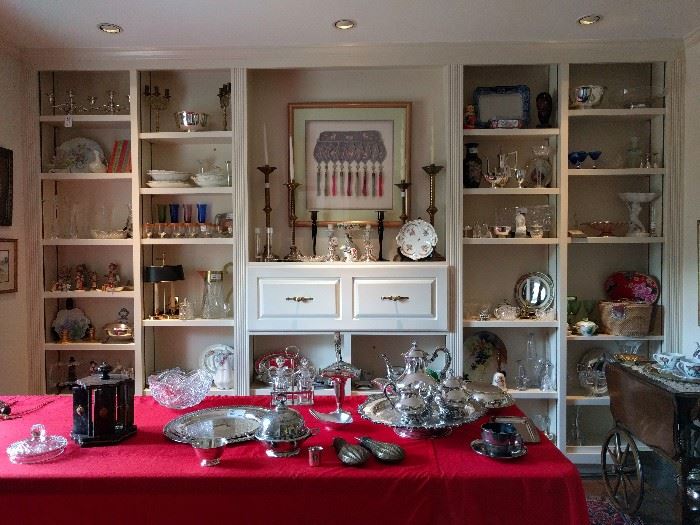 A dining room FULL of very nice collectibles, lot's of silver plated hollowware and some good pieces of sterling.